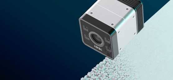 Cámara IDS iTof 3D delante de un fondo con elevaciones tridimensionales.