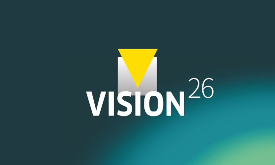 Gráfico con la inscripción «VISION26» sobre un fondo azul verdoso.