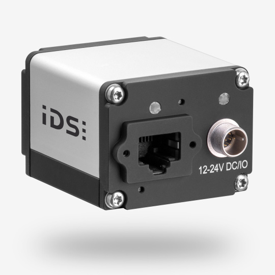 Cámara industrial IDS uEye SE vista trasera angular con conexiones.